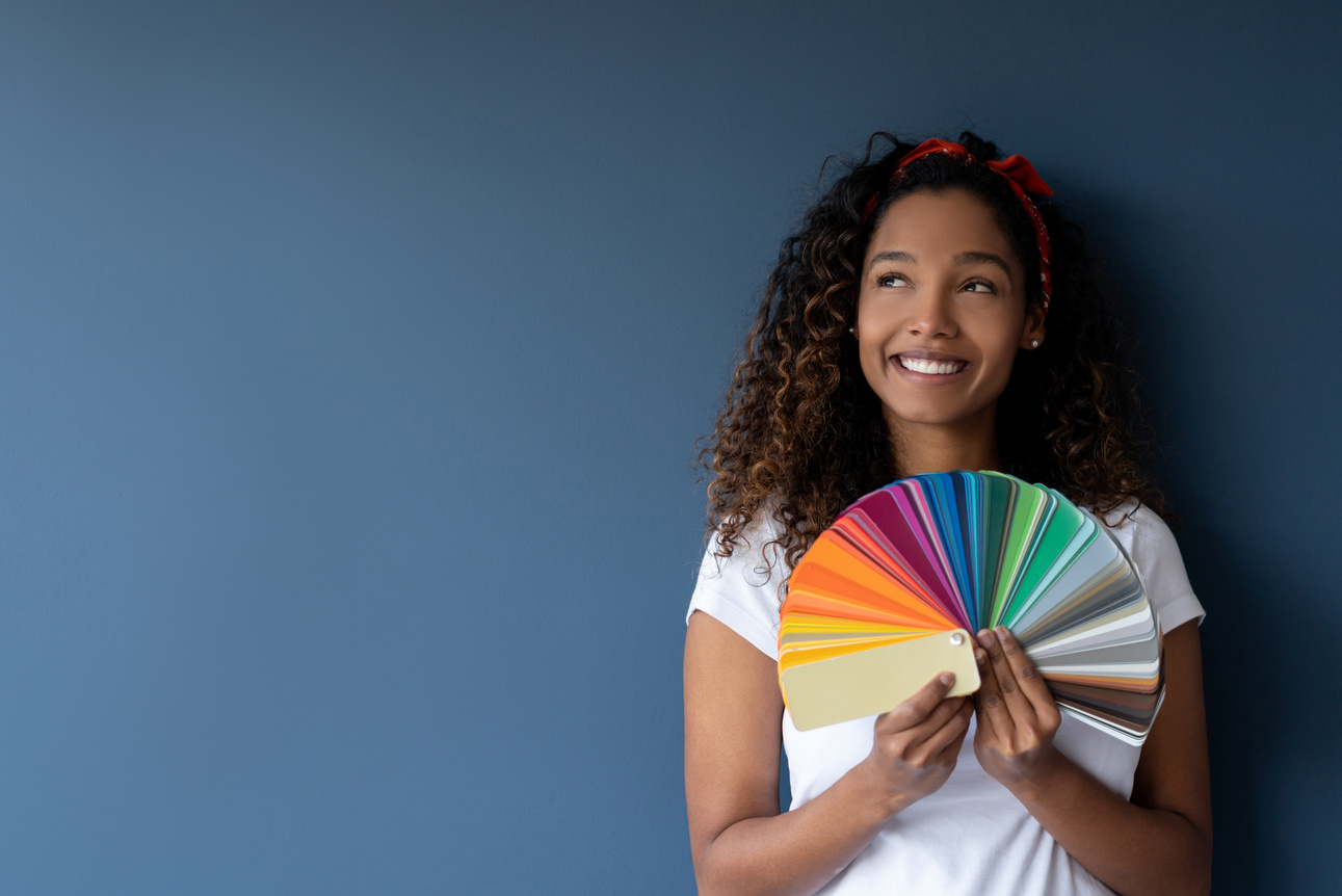 Woman thinking about painting her house